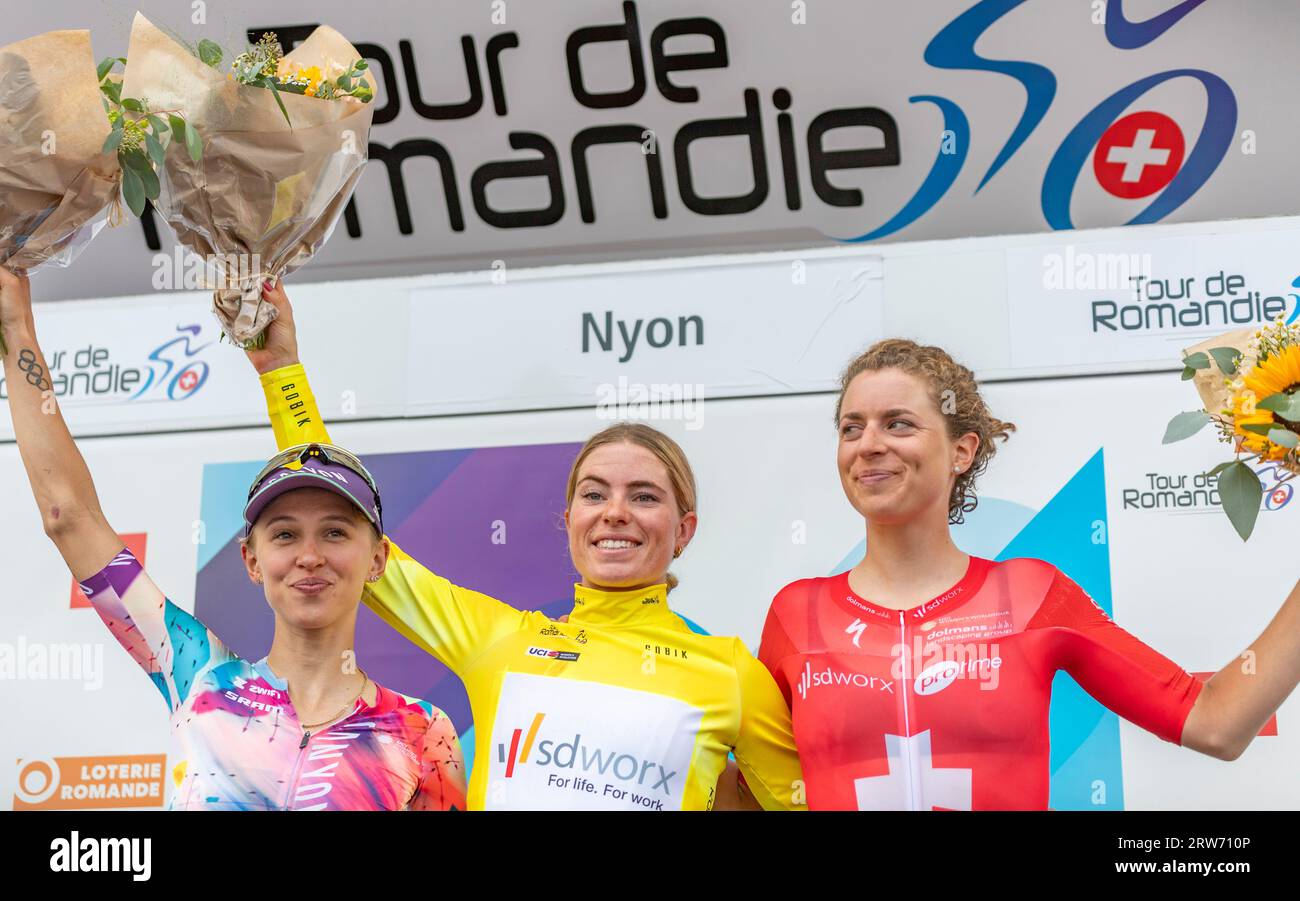 Nyon, Vaud, Switzerland. 17th Sep, 2023. Nyon Switzerland, 09/17/2023: The podium of the Tour de Romandie Féminin: the winner of the tour the Dutch Demi VOLLERING of the SD Worx (Middle), the second the Polish Katarzyna NIEWIADOMA of the CANYON//SRAM RACING Team (Left) and the Swiss Marlen REUSSER of SD Worx Team (Right) during The arrival of 2nd Tour de Romandie women's . The arrival of 2nd Tour de Romandie women's took place on the shore of Lake Geneva in the city of Nyon. Credit: ZUMA Press, Inc./Alamy Live News Stock Photo