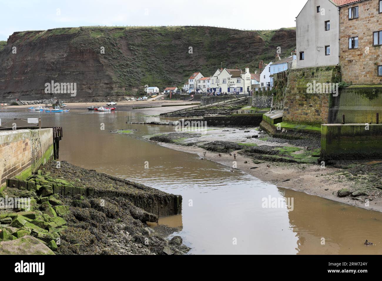Staithes Harbour and the Cod and Lobster Pub, North Yorkshire, UK Stock Photo