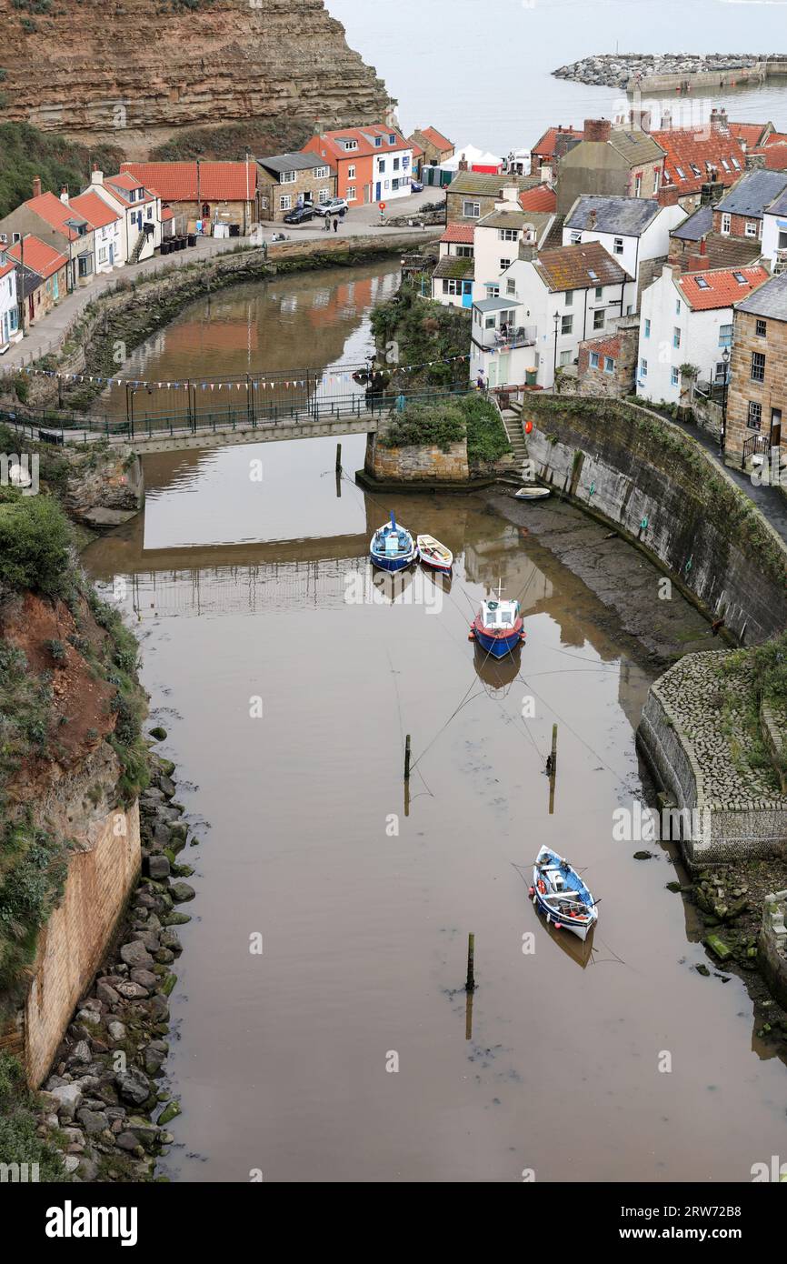 Staithes Village and Fishing Boats in Staithes Beck, North Yorkshire, UK Stock Photo