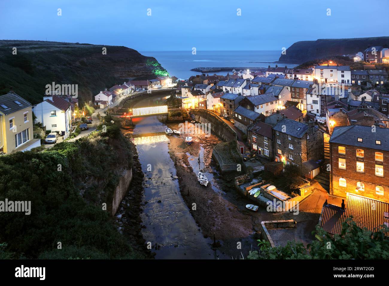 Staithes Village at Dusk During the Staithes Festival of Arts and Heritage, North Yorkshire, UK Stock Photo