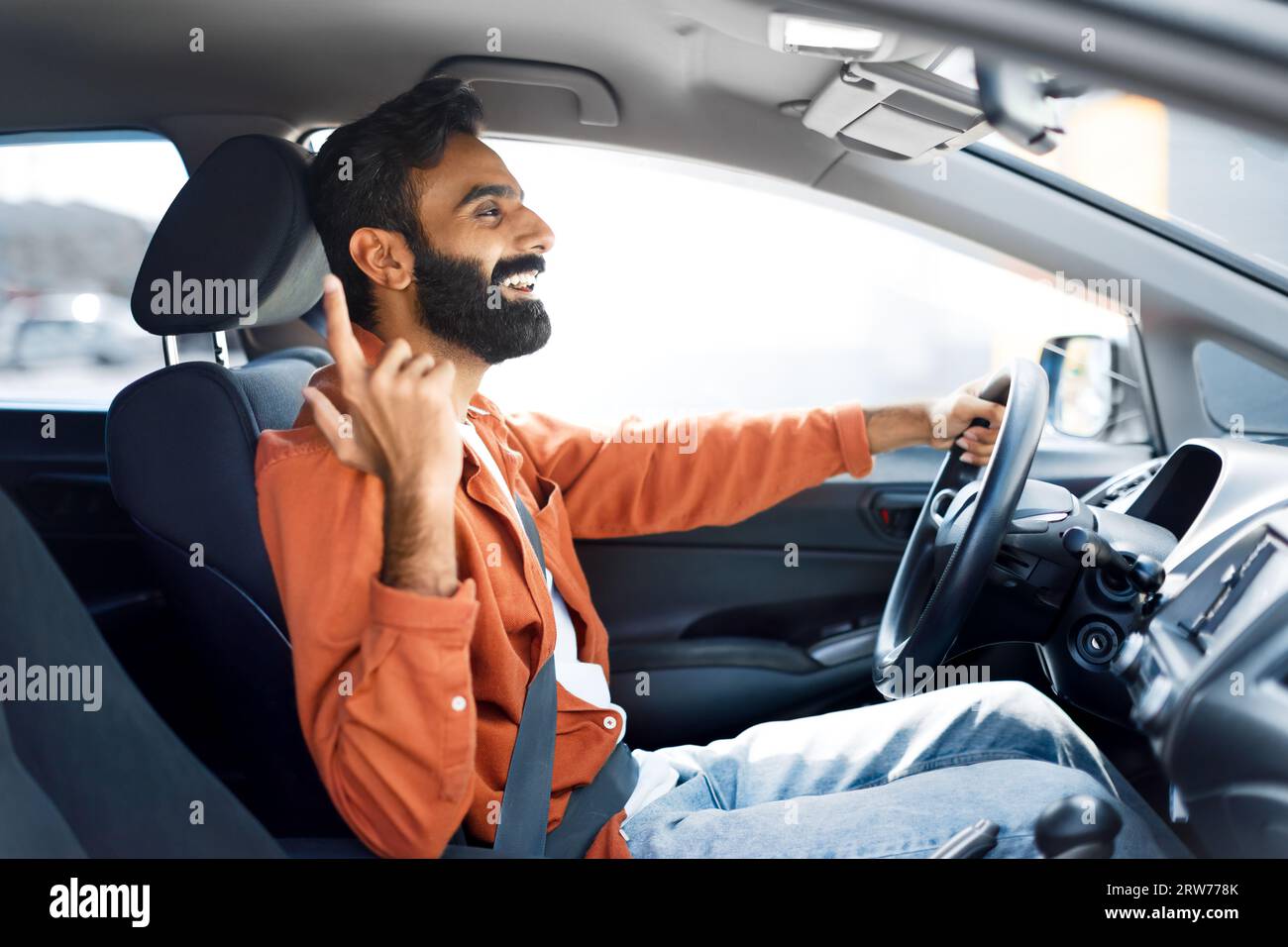 Arab Man Riding Automobile Vehicle, Driving Sitting In Driver's Seat Stock Photo