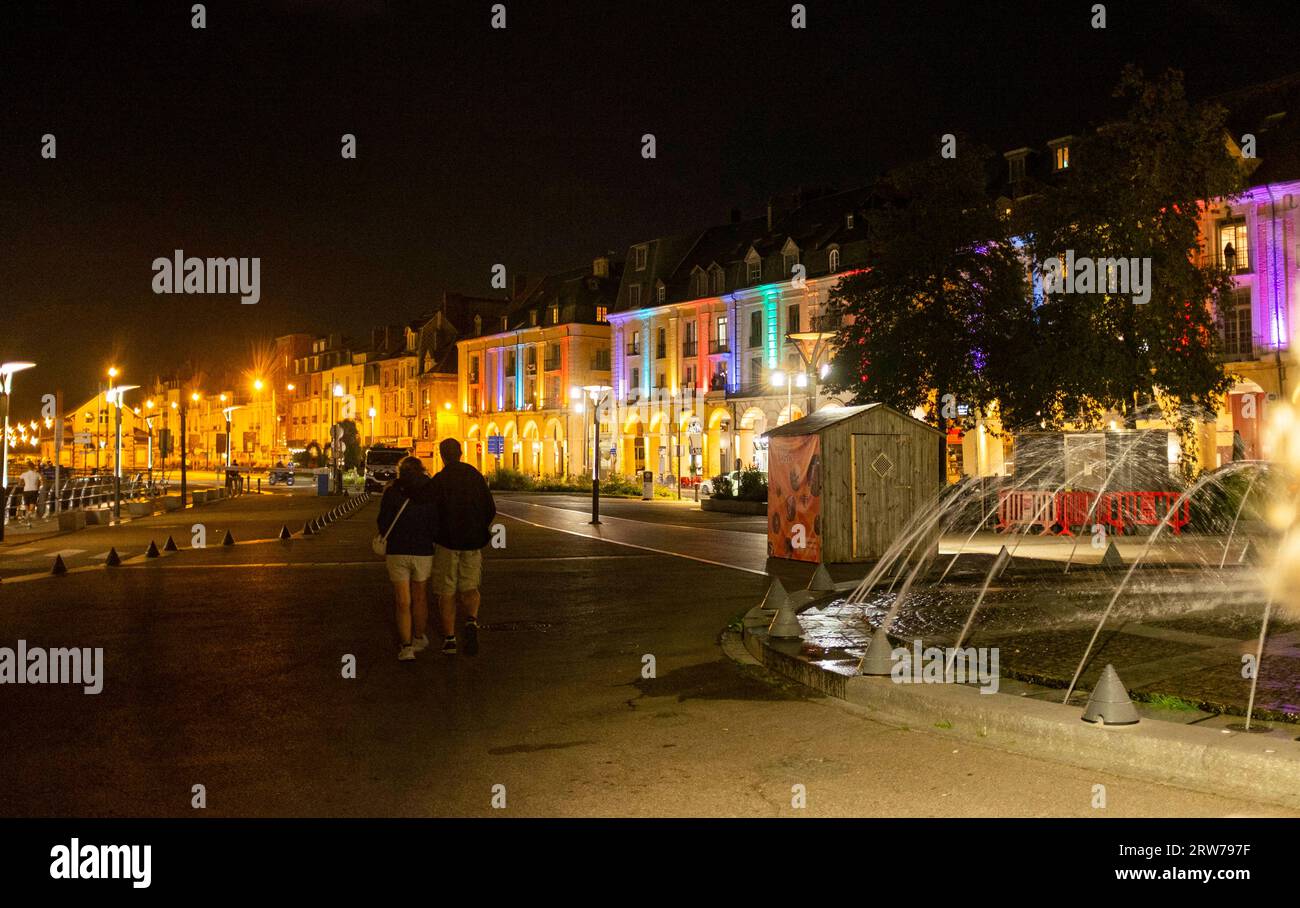 Buildings and fountain lit up at night in Dieppe , Normandy  Dieppe is a fishing port on the Normandy coast of northern France Stock Photo