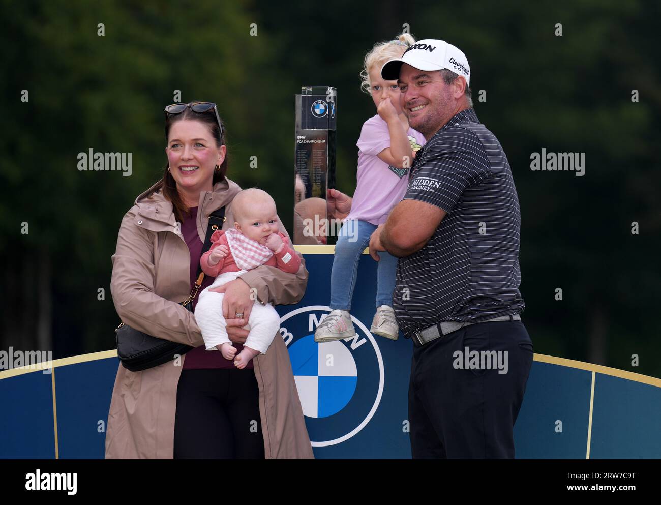 Ryan Fox poses with the trophy with wife Anneke Ryff and daughters