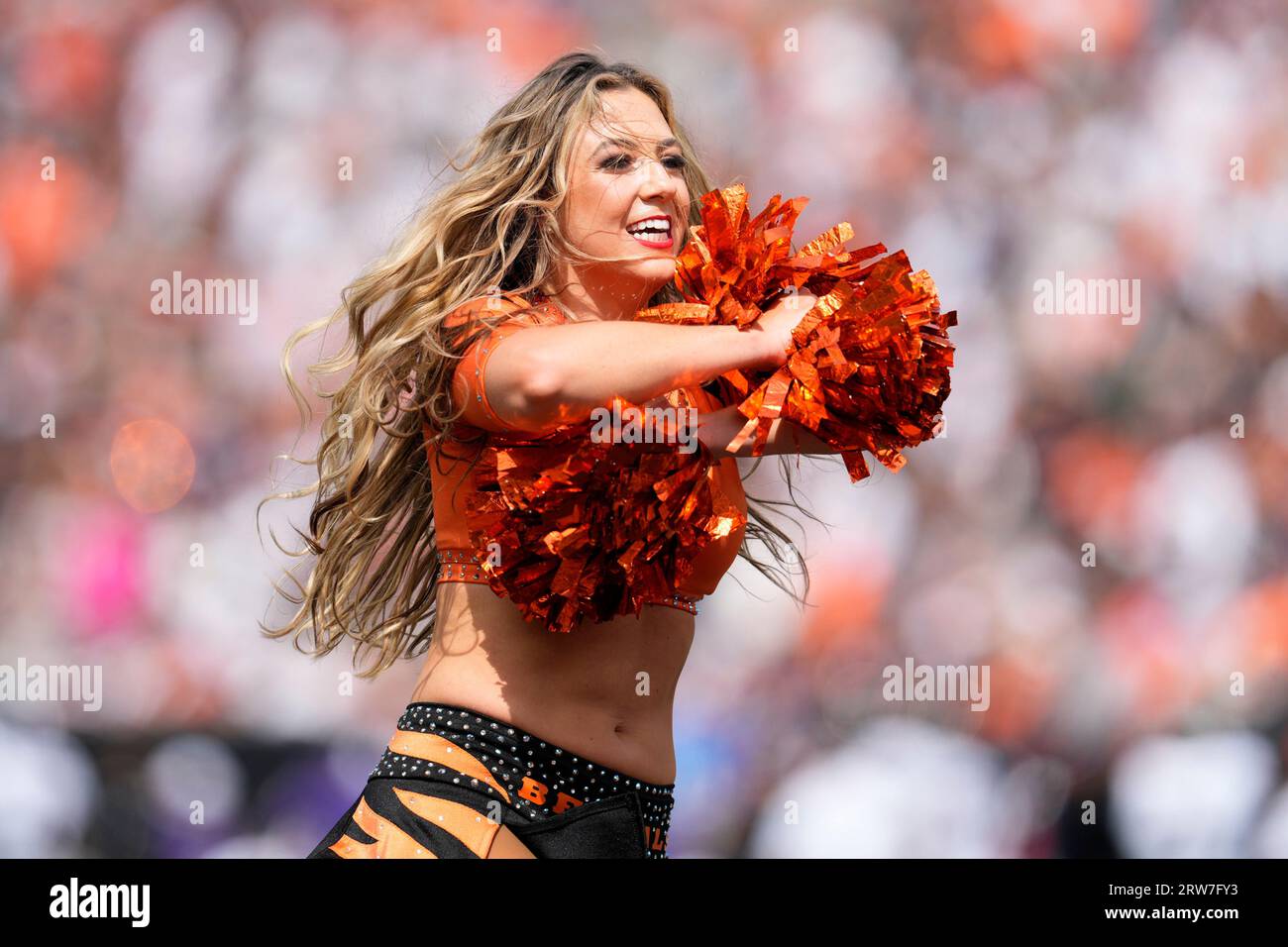 A cheerleader is seen before the first half of an NFL football