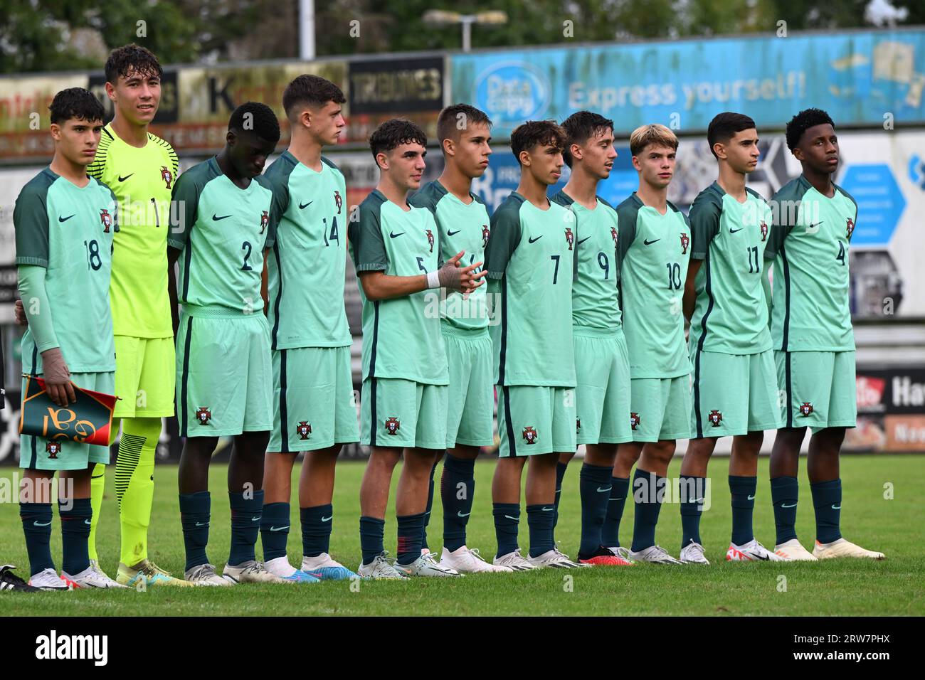 players of Portugal with Simao Soares (18) of Portugal, goalkeeper Leonardo Lopes (1) of Portugal, Daniel Banjaqui (2) of Portugal, Martim Antunes (14) of Portugal, Jose Domingues (5) of Portugal, Rafael Quintas (6) of Portugal, Joao Aragao (7) of Portugal, Tomas Soares (9) of Portugal, Joao Abreu (10) of Portugal, Ricardo Pereira (11) of Portugal and Mauro Furtado (4) of Portugal pictured during the national anthems ahead of a friendly soccer game between the national under 16 teams of Portugal and Belgium on Sunday 17 September 2023 in Sint-Niklaas, Belgium . PHOTO SPORTPIX | David Catry Stock Photo