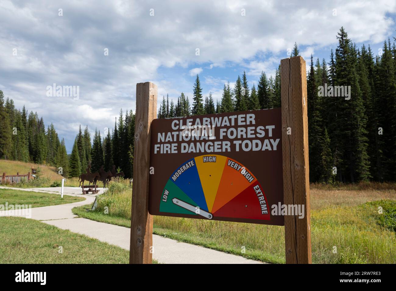 A fire danger sign warns of low wildfire danger at Lolo Pass Visitor Center, Lolo Pass, Idaho. Stock Photo