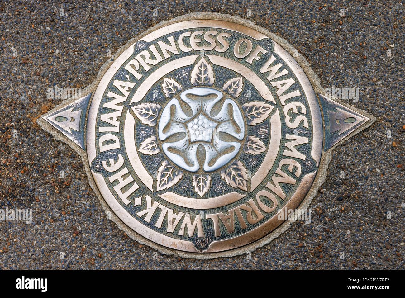 London, UK - May 23, 2023: Metal bronze symbol of The Diana Princess of Wales Memorial Walk with Alec Peever rose emblem Stock Photo
