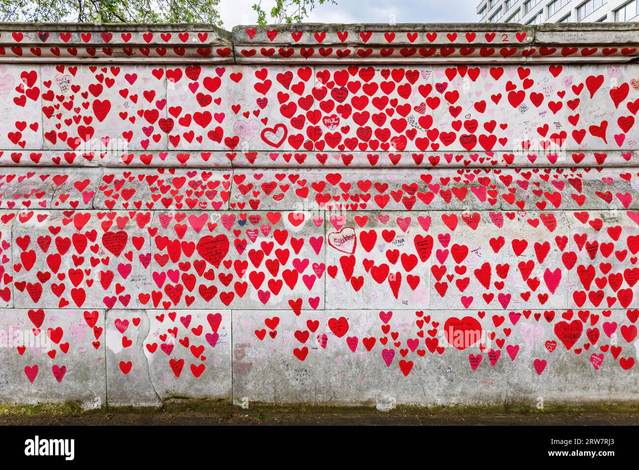 London, UK - May 17, 2023:  National Covid Memorial Wall showing hearts that represent the people died from Covid-19, a visual representation of the U Stock Photo