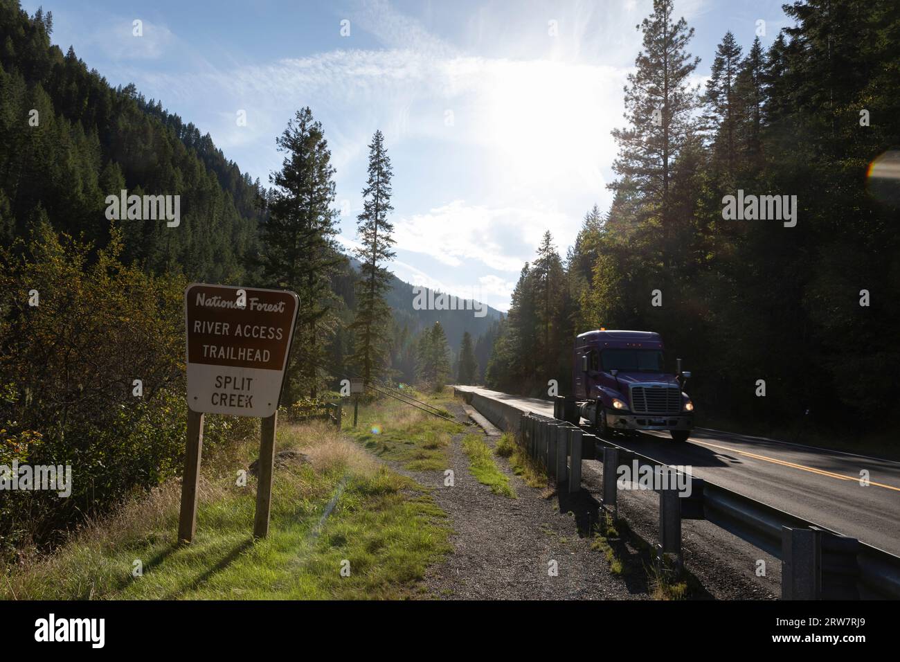 A truck on US Highway 12 passes the Split Creek Trailhead trailhead along the Lochsa River in the Nez Perce-Clearwater National Forest, Idaho. Stock Photo