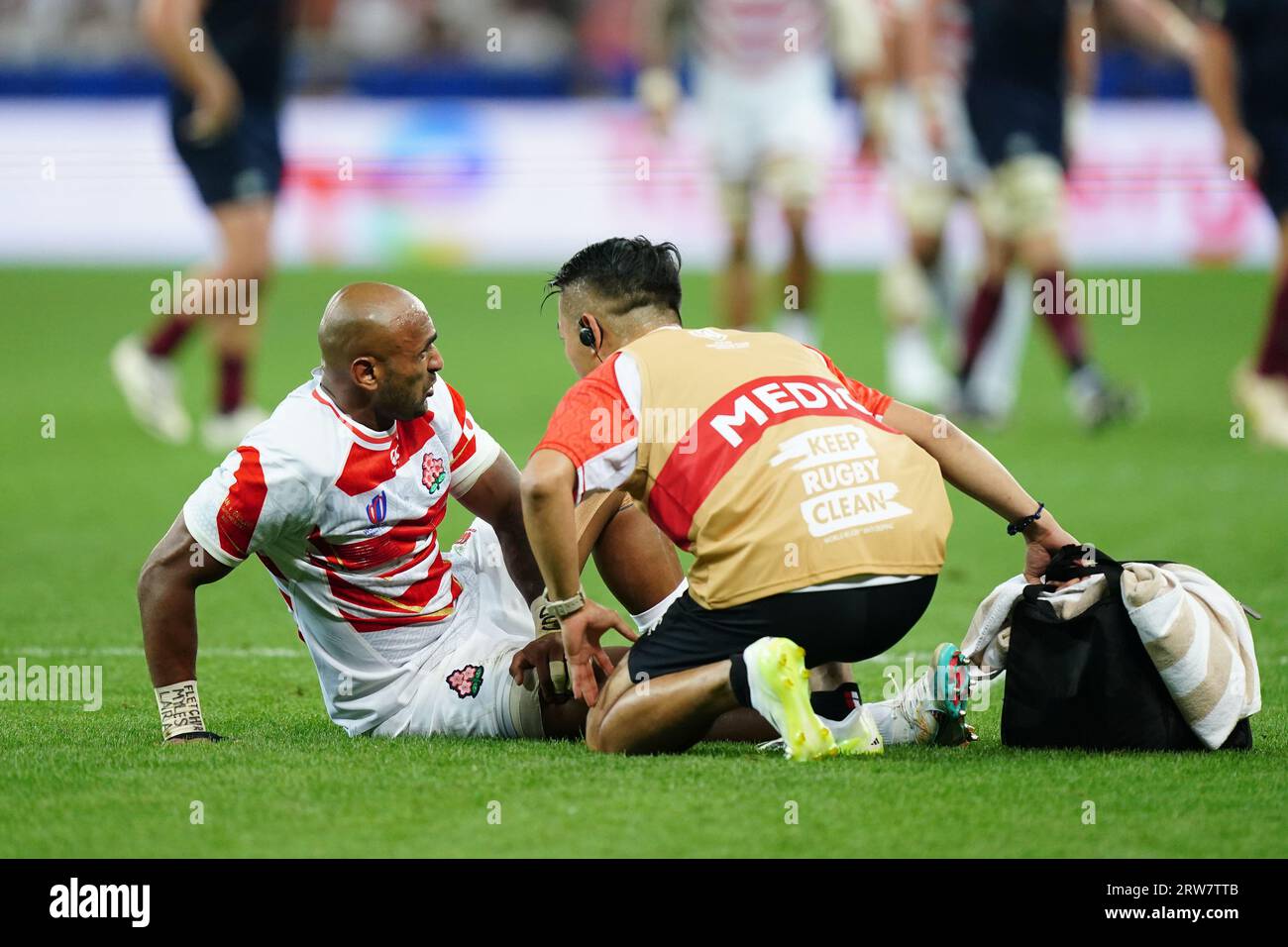 Japan's Semisi Masirewa receives medical attention during the Rugby