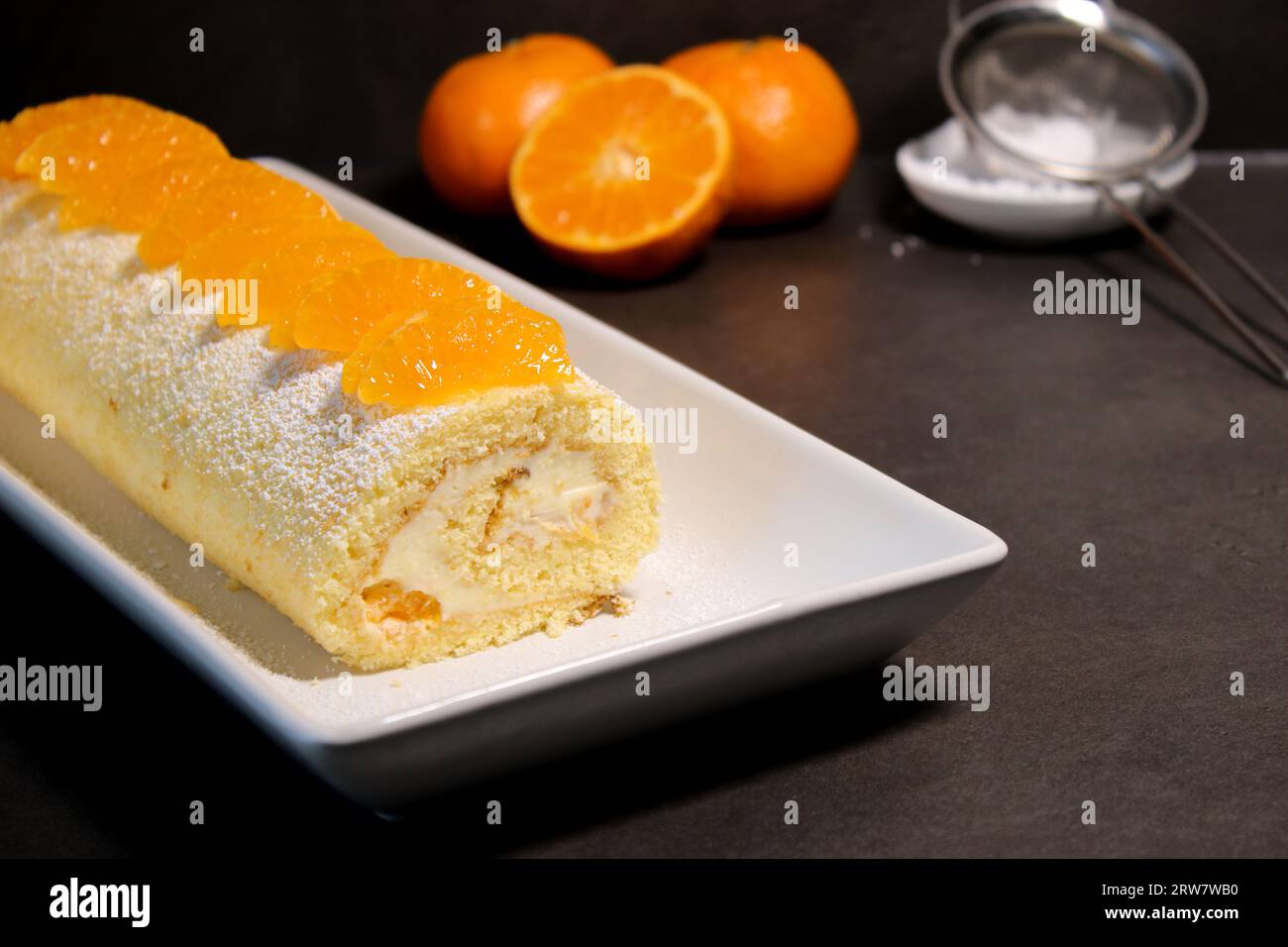 Delicious homemade mandarin cake roll with buttercream feeling, white ...