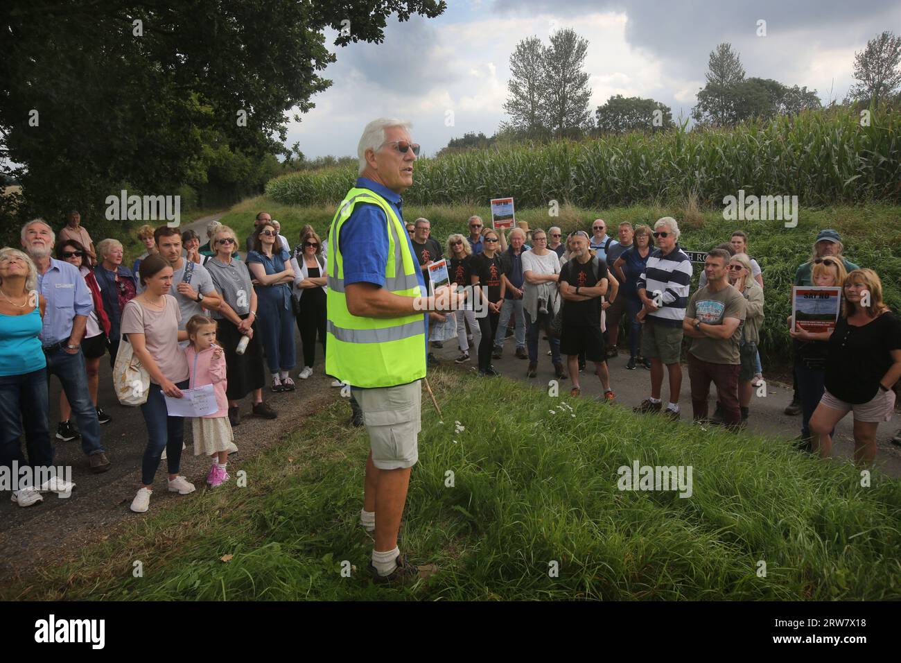 Forncett St Mary, Norfolk, UK. 17th Sep, 2023. Norman talks to members of the Essex Suffolk Norfolk Pylons campaign group and other protesters about the proposed pylon run around the village of Forncett St Mary. The 50m tall pylons, proposed by the National Grid, will stretch 180km through the countryside reinforcing the existing network and connecting offshore wind generation between Norwich and Tilbury. Credit: SOPA Images Limited/Alamy Live News Stock Photo