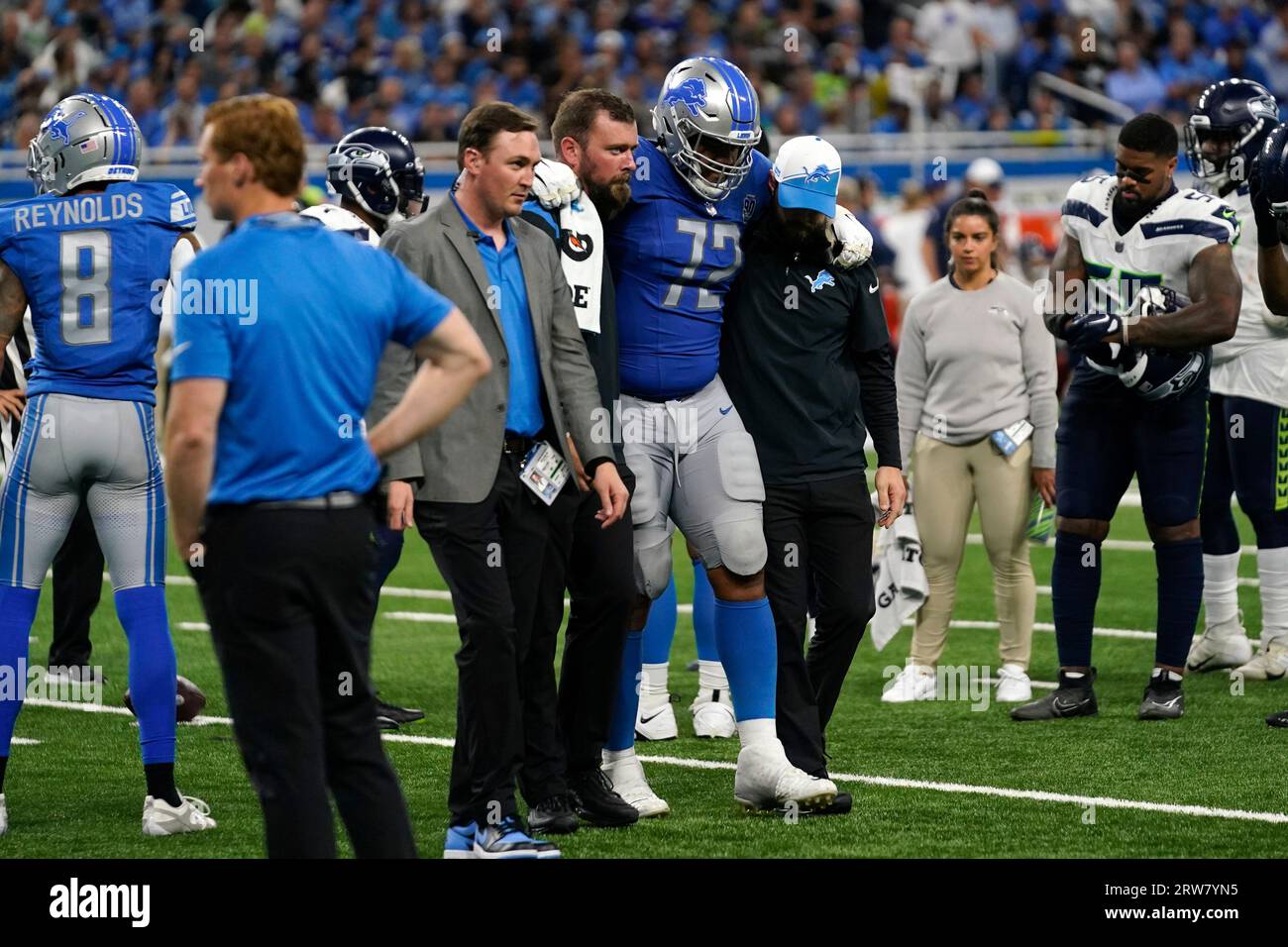 Detroit Lions guard Halapoulivaati Vaitai (72) is helped off the