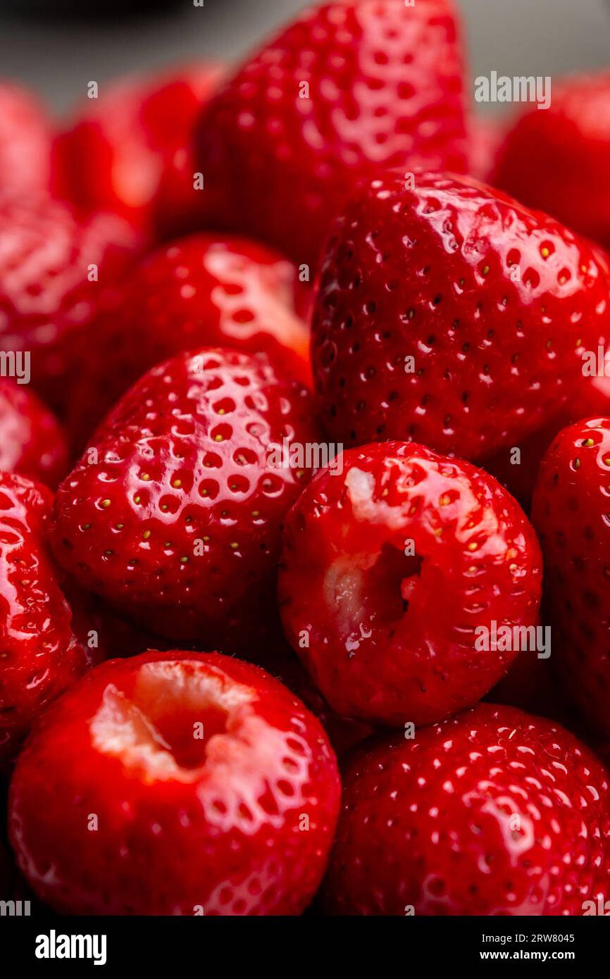 A pile of ripe strawberries hulled and ready to eat Stock Photo - Alamy