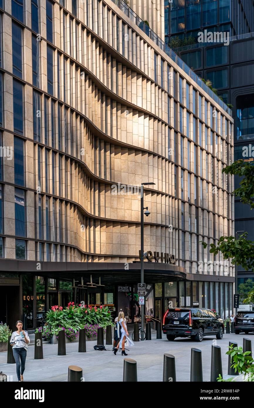 New York, NY - US - Sept 7, 2023 Vertical view of people waiting for taxis at the entrance of the Equinox Hotel at 35 Hudson Yards. Stock Photo