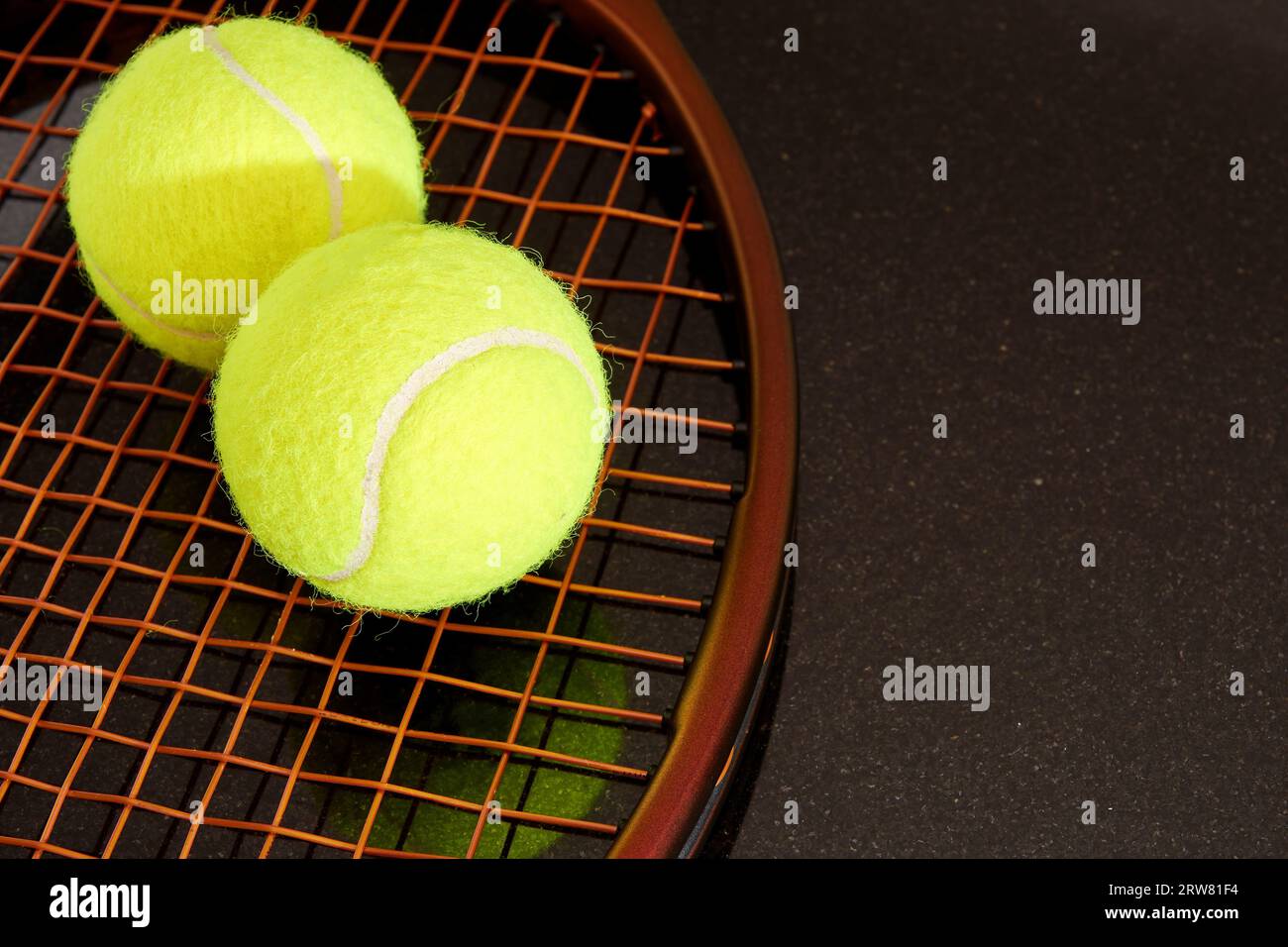 Yellow tennis balls on brown racquet with new brown strings. Isolated ...