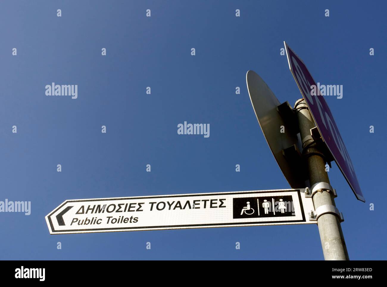 Sign to the public mens and womens and disabled restroom restrooms with