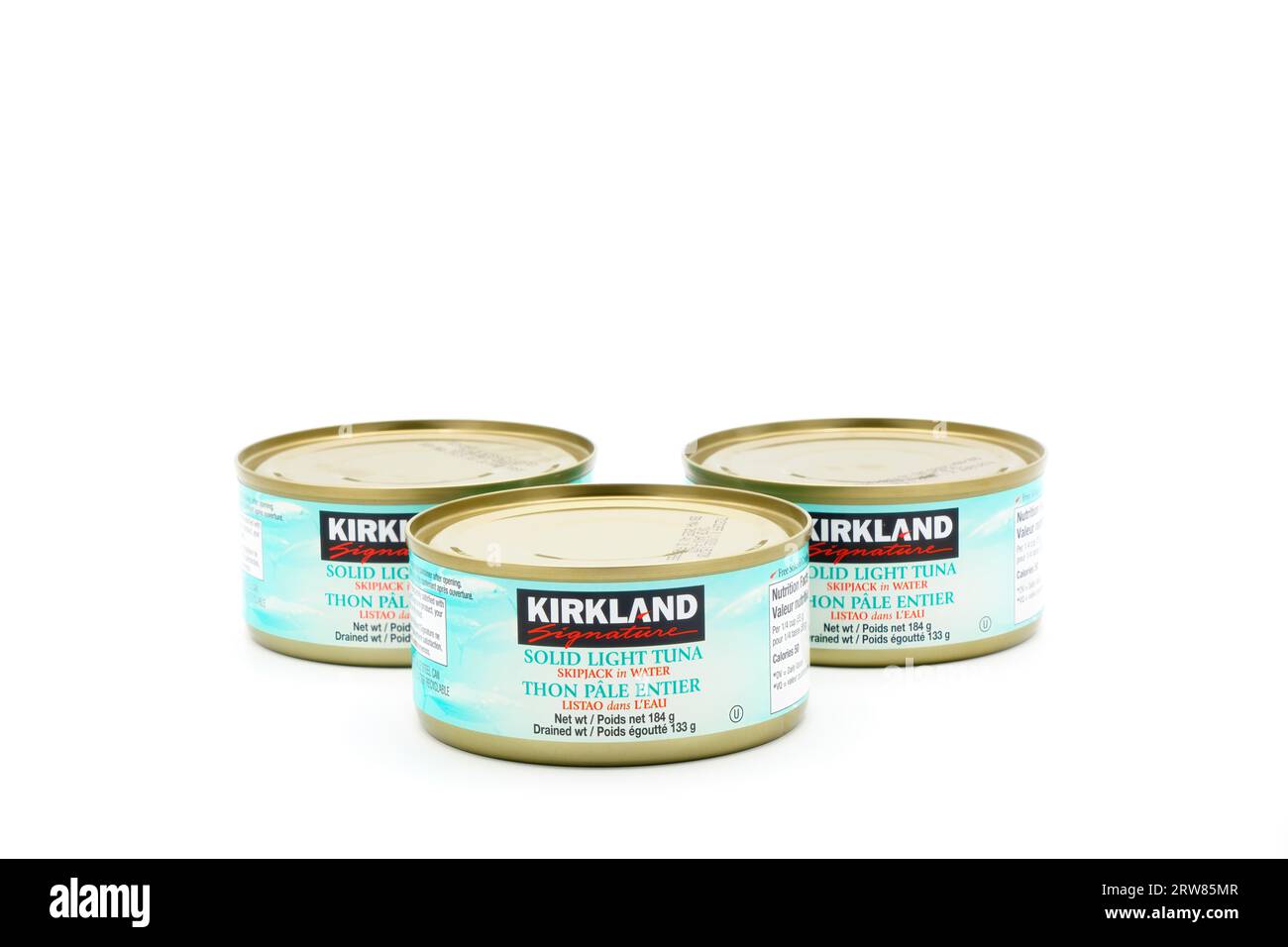 Tins of Kirckland Brand Solid Light Tuna.  Kirkland Brand is a private label sold exclusively at Costco wholesale stores. Stock Photo