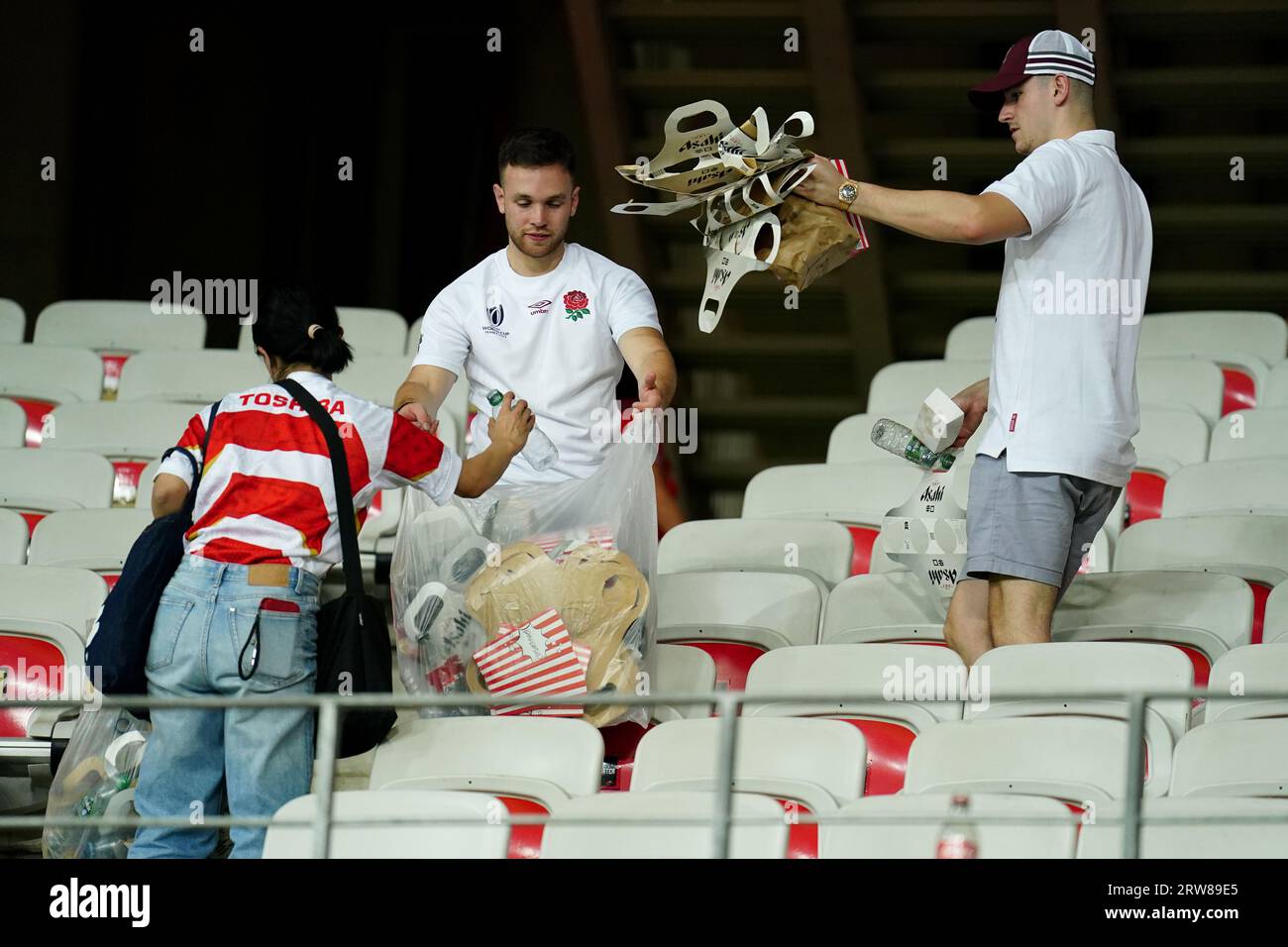 England and Japan fans help to clear remaining litter from the stadium following the Rugby World Cup 2023, Pool D match at the Stade De Nice, France. Picture date: Sunday September 17, 2023. Stock Photo