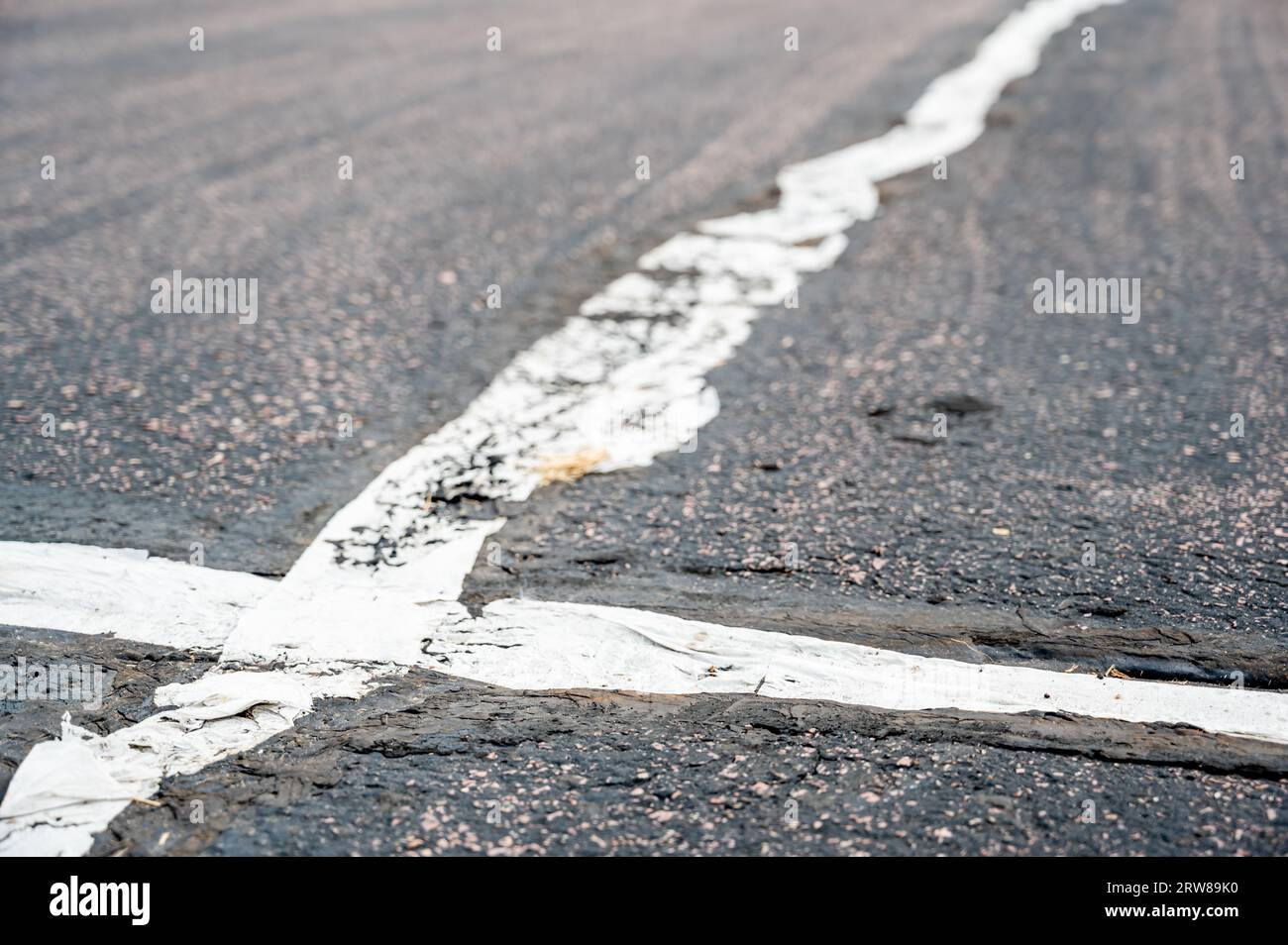 fabric coving on top of an asphalt crack repair Stock Photo Alamy