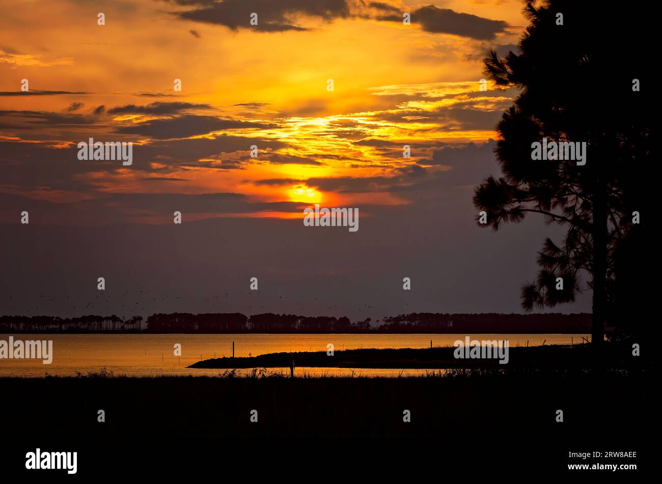 The sun sets at Lightning Point, Sept. 14, 2023, in Bayou La Batre, Alabama. Stock Photo