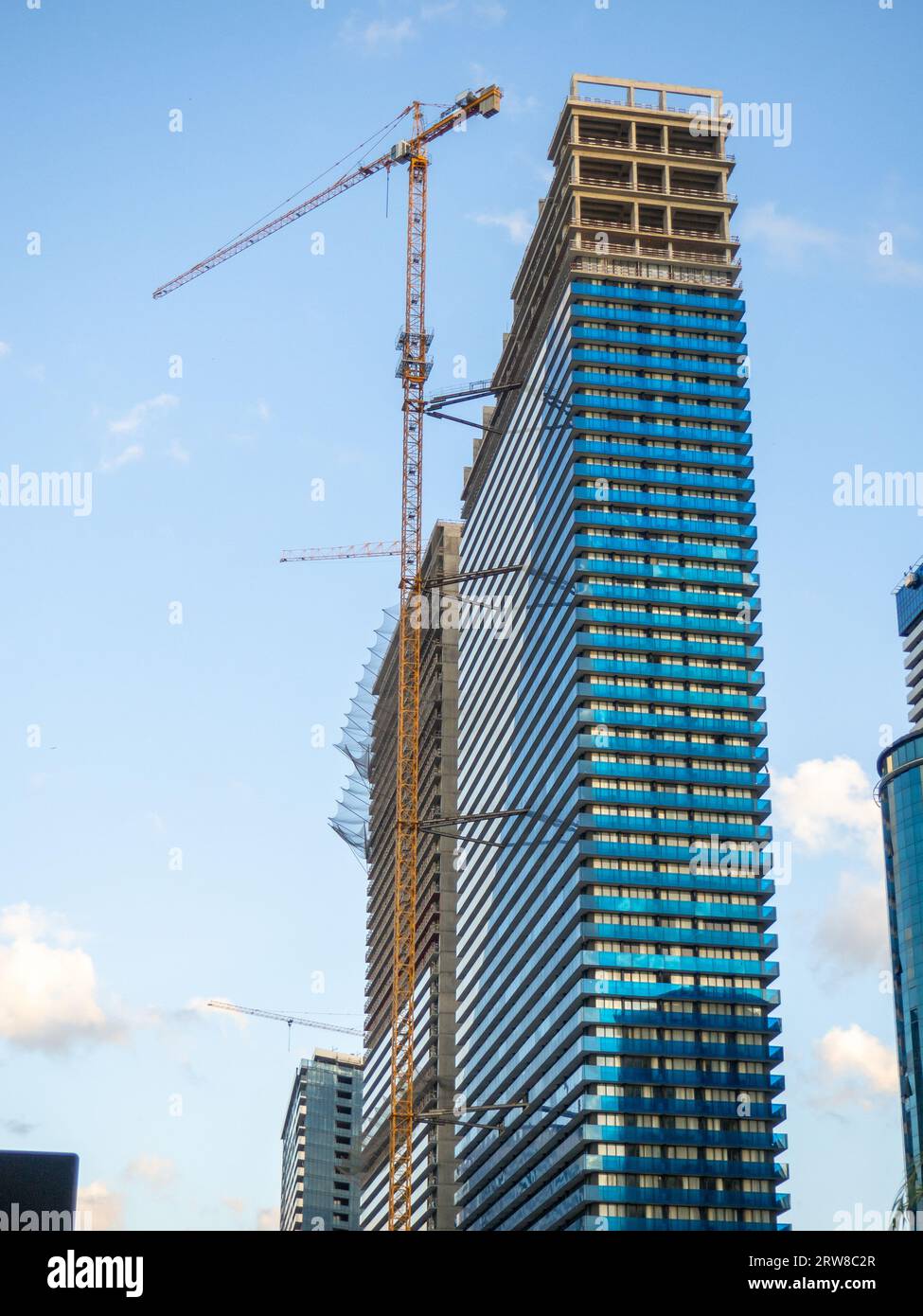Highrise building under construction. Orbi city. Blue skyscraper. The