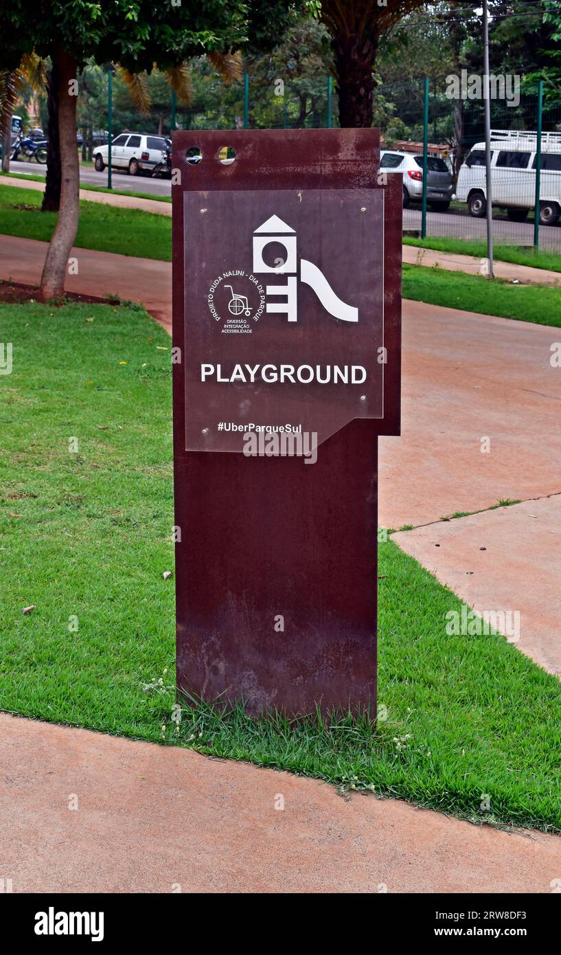 RIBEIRAO PRETO, SAO PAULO, BRAZIL - April 17, 2023: Metal display totem on public park indicating Playground Area Stock Photo