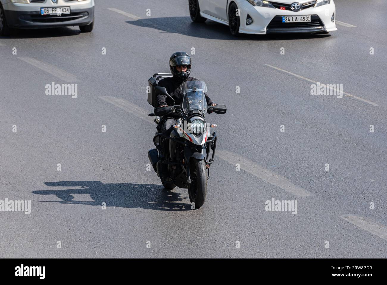 ISTANBUL, TURKEY - SEPTEMBER 17, 2023: Man from city riding motorcycle on the Istanbul road. Stock Photo