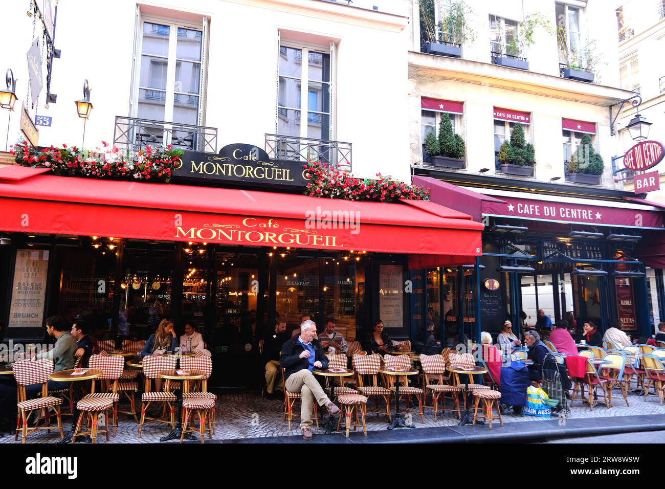 Cafes lining Rue Montorgueil in Paris France Stock Photo