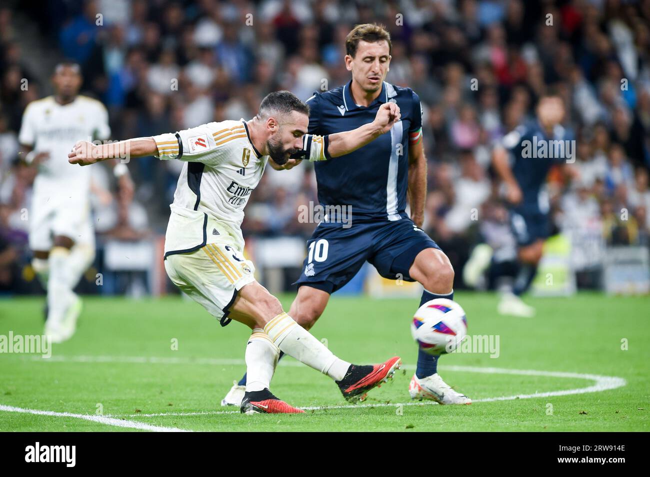 Madrid, Spain. 17th Sep, 2023. Dani Carvajal (L) of Real Madrid competes during a Spanish La Liga football match between Real Madrid and Real Sociedad in Madrid, Spain, Sept. 17, 2023. Credit: Gustavo Valiente/Xinhua/Alamy Live News Stock Photo