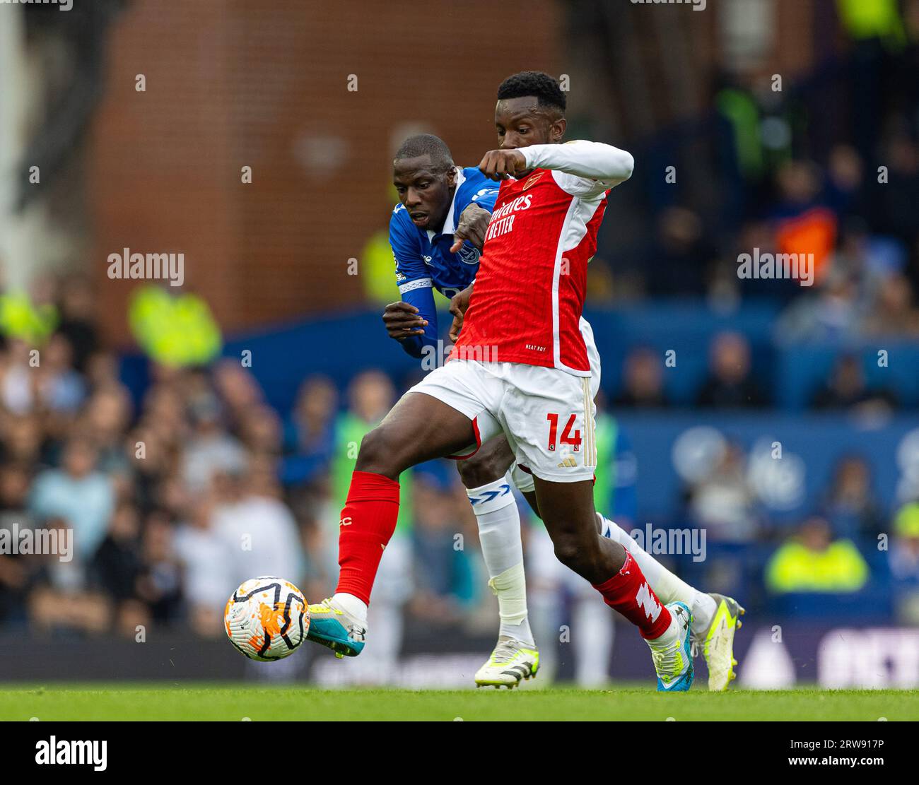 London, UK. 18th Sep, 2023. Arsenal's Eddie Nketiah (R) is challenged by Everton's Abdoulaye Doucoure during an English Premier League match between Everton and Arsenal in Liverpool, Britain, on Sept. 17, 2023. Credit: Xinhua/Alamy Live News Stock Photo
