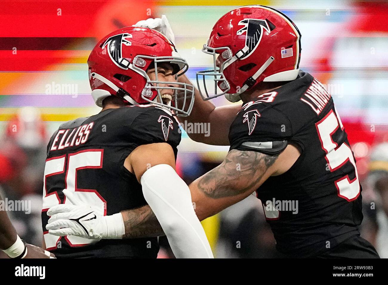 Atlanta Falcons linebacker Kaden Elliss, center, celebrates his sack on