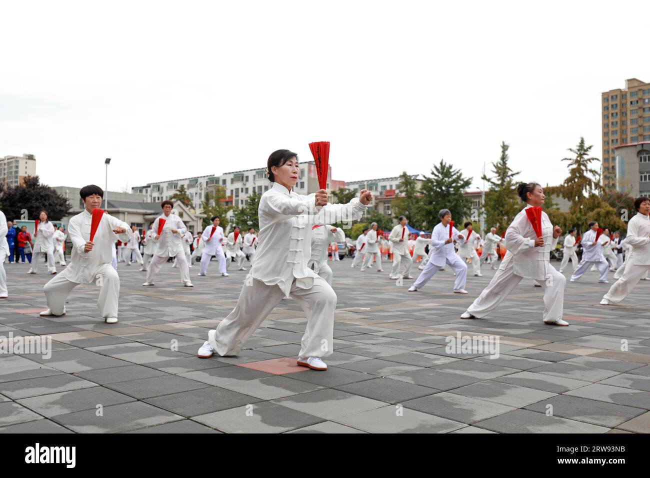 LUANNAN COUNTY, China - October 10, 2021: people practice Tai Chi Kung Fu Fan in the park, North China Stock Photo