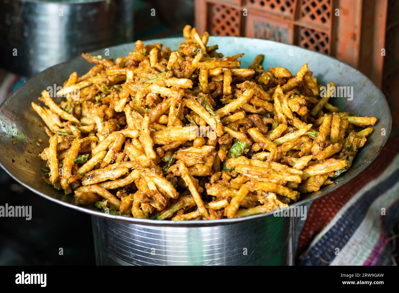 potato finger fries deep fried in oil kept at shop for sale at day
