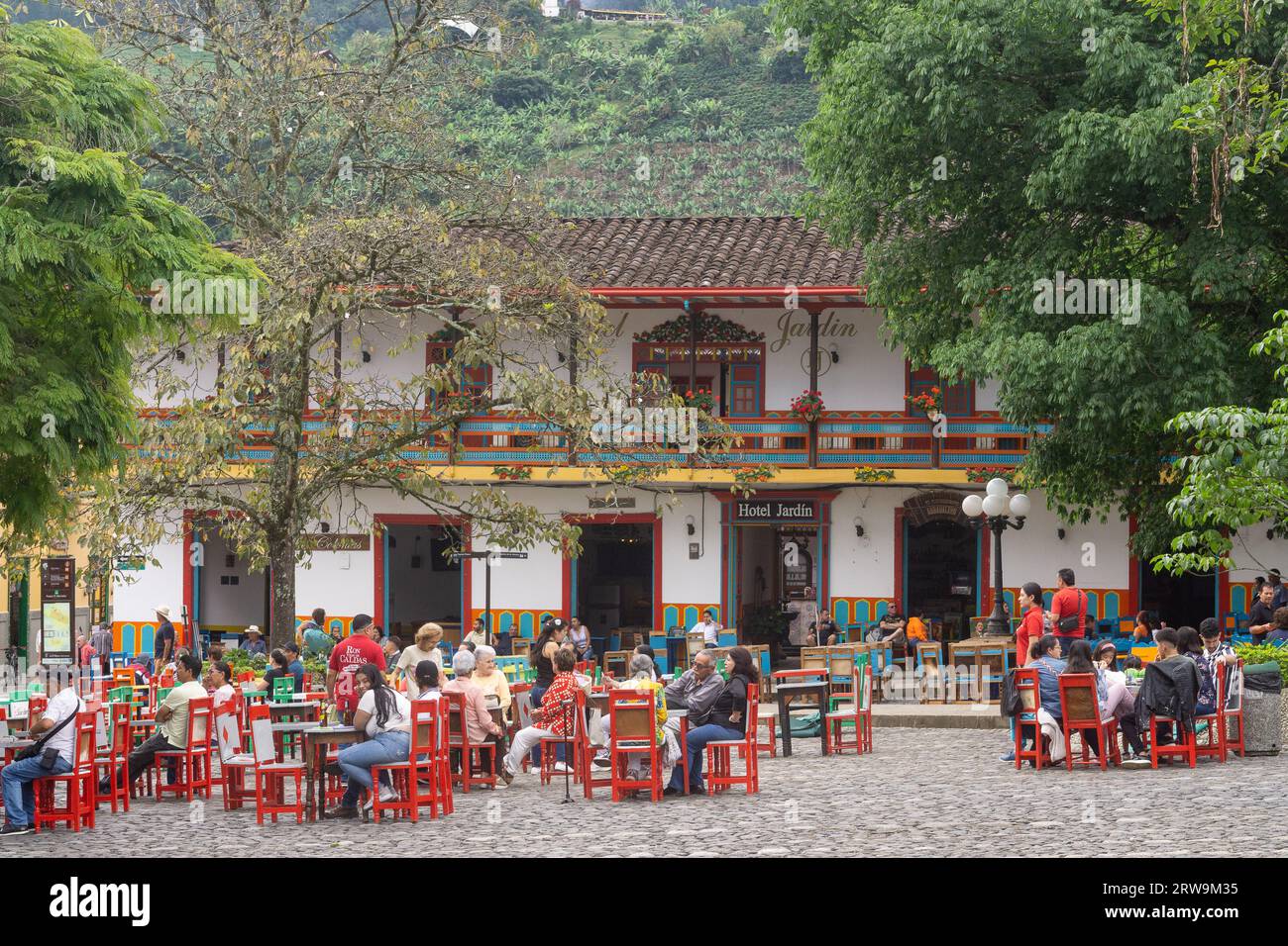 Locals and tourists enjoying afternoon at the main square in Jardin, Antioquia, Colombia. Stock Photo