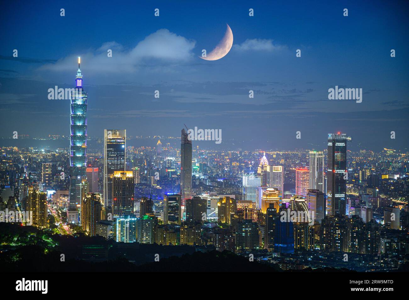 Urban splendor at night: Watch the dynamic clouds and moon above the ...
