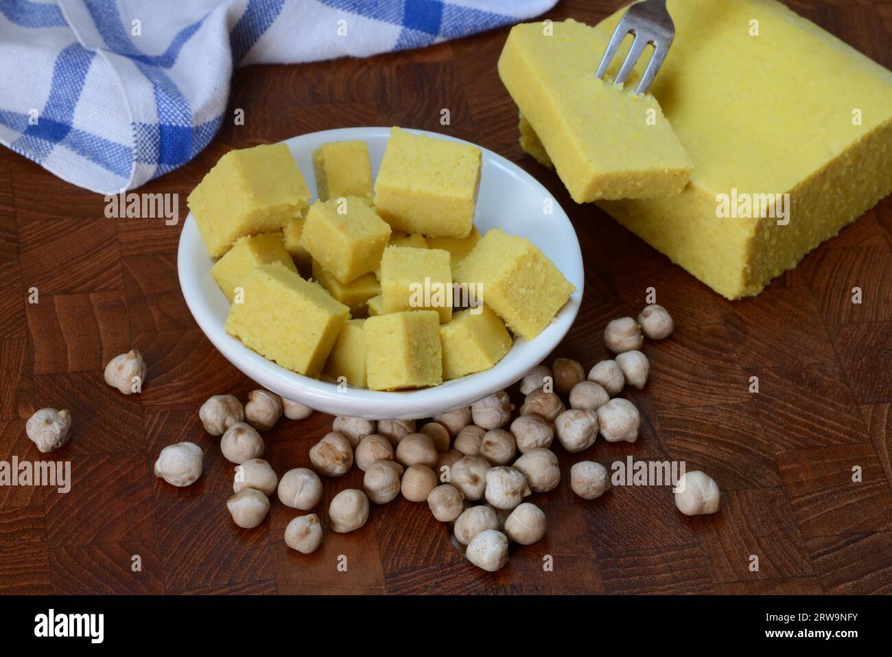 Kofu, chickpea tofu, block and cube in small bowls, chickpeas Stock