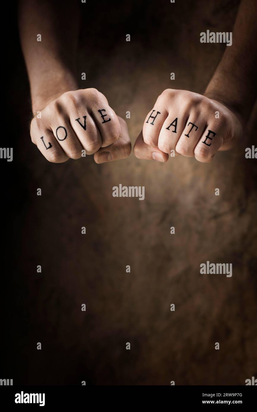 Man with Love and Hate (fake) tattoos Stock Photo
