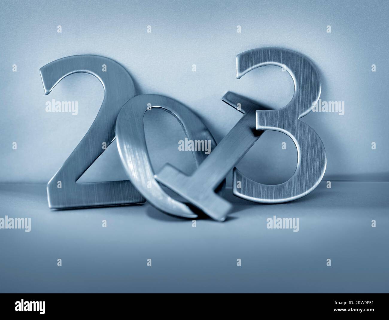 Metallic numbers for year 2013. Short depth-of-field. Note: the background may appear grainy, that's because it's grainy paper Stock Photo