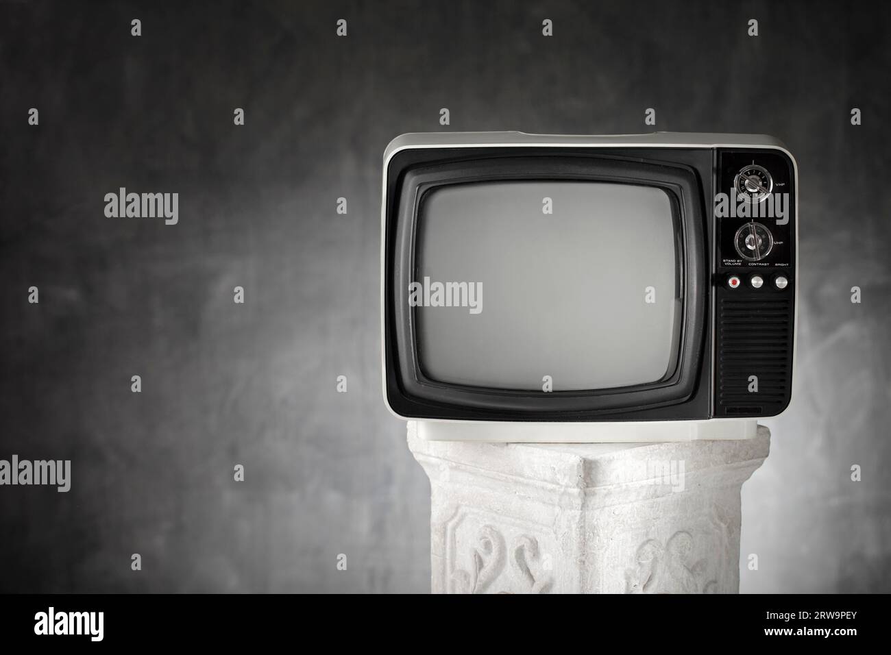 Old portable television on a plaster column Stock Photo Alamy