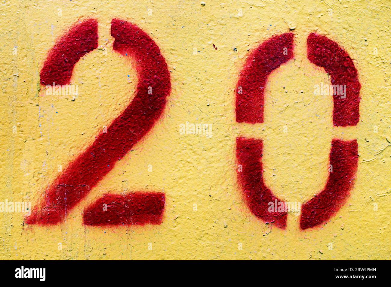 Number 20 painted with red paint and a stencil Stock Photo