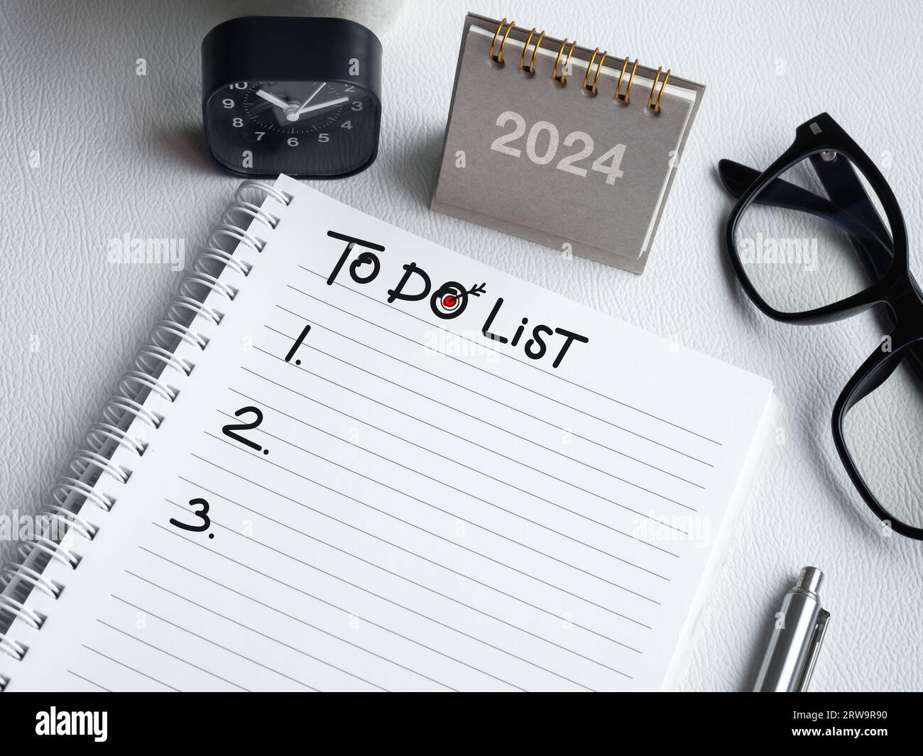 New year to do list. Handwriting text and list numbers on blank notepad ...