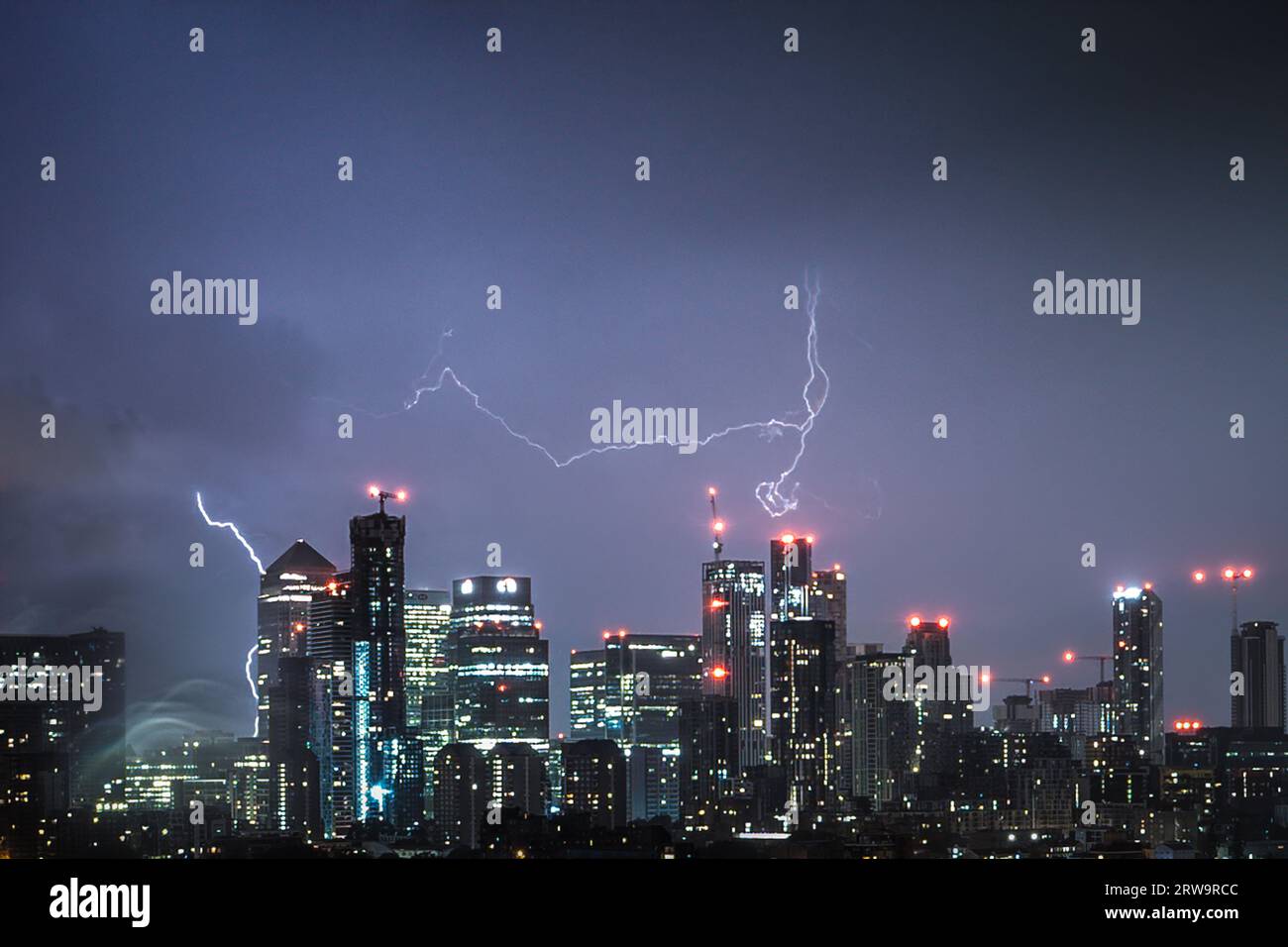 London, UK. 18th September 2023. UK Weather: Lightning strikes over Canary Wharf in the early hours of Monday as yellow warnings are issued by the Met Office for the east midlands and south-east England. Credit: Guy Corbishley/Alamy Live News Stock Photo