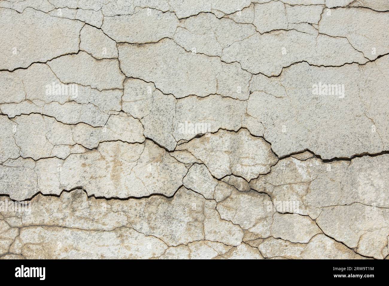 deep horizontal cracks on old wall plaster - full-frame texture and background Stock Photo