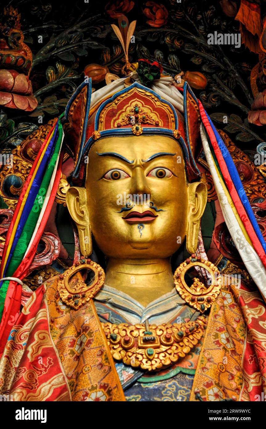 Decorated golden statue of buddhist deity in Nepal Stock Photo - Alamy