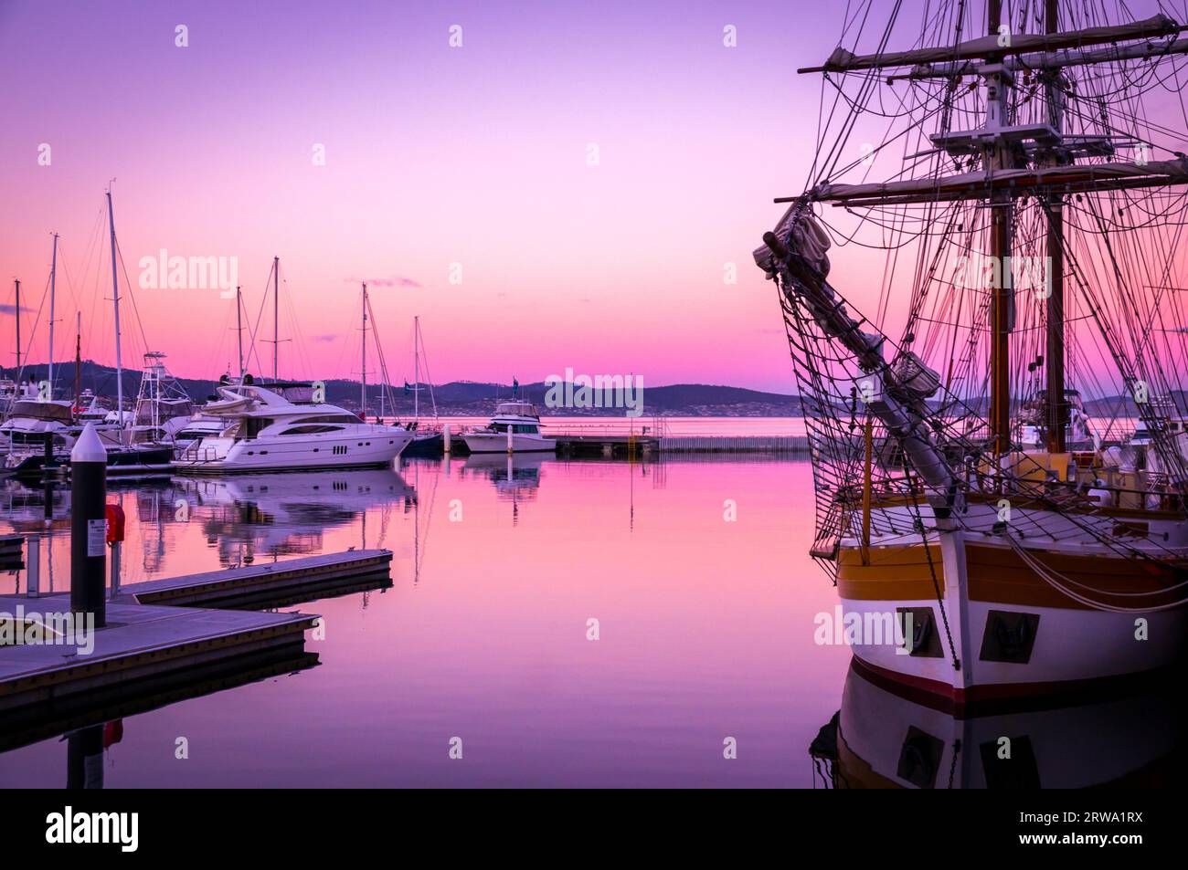 Sail boats at sunset in Victoria Dock in Hobart, Tasmania Stock Photo
