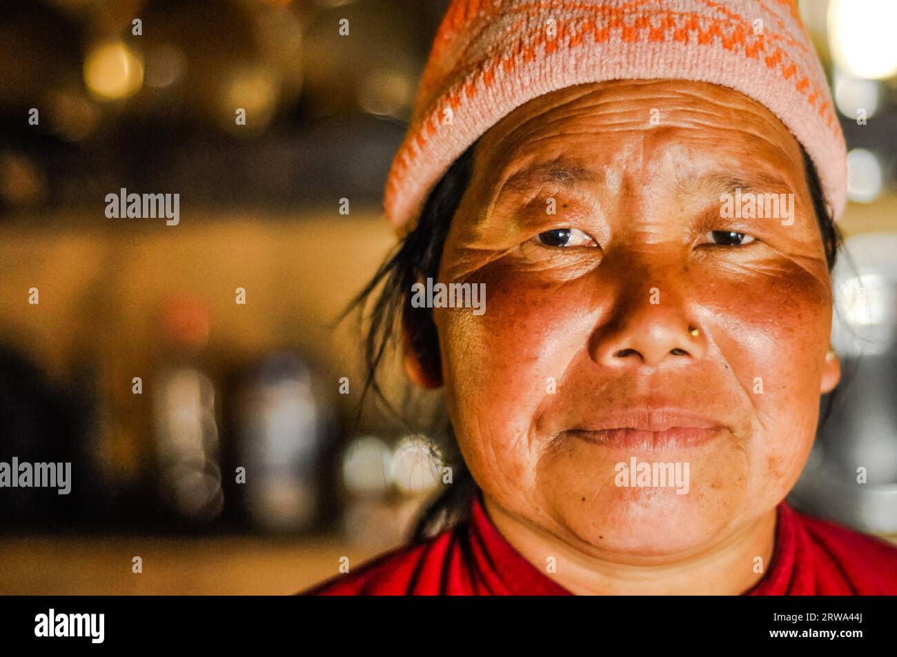 Kanchenjunga Trek, Nepal, circa May 2012: Woman with red cheeks and