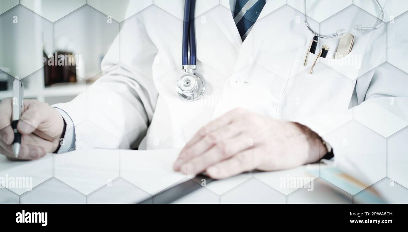 Doctor prescribing medication in office hi-res stock photography and ...
