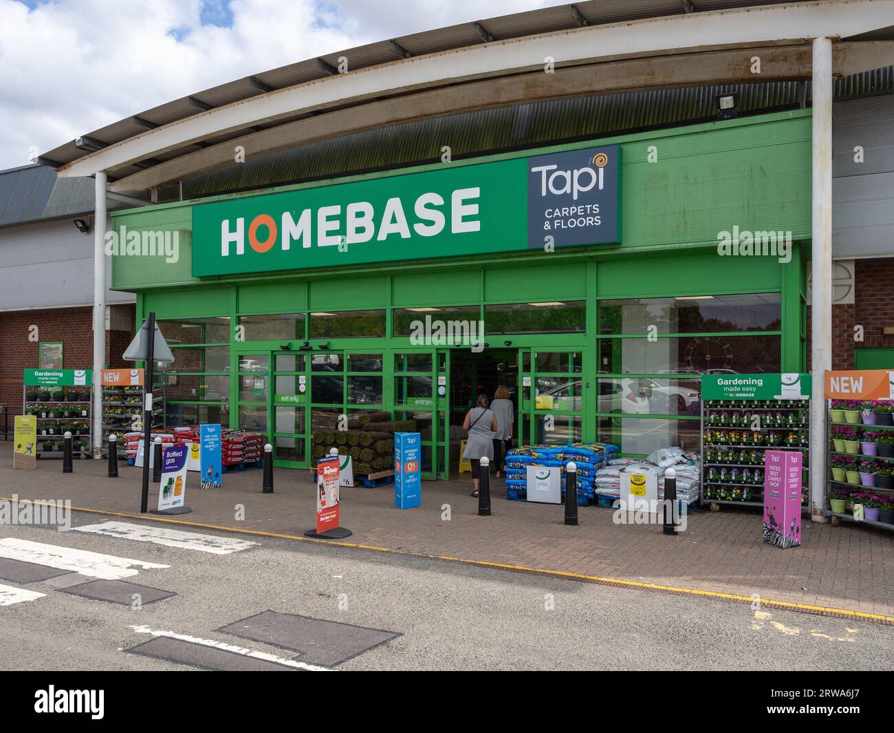 Exterior of a Homebase store, including Tapi Carpets, Riverside Retail Park, Northampton, UK Stock Photo