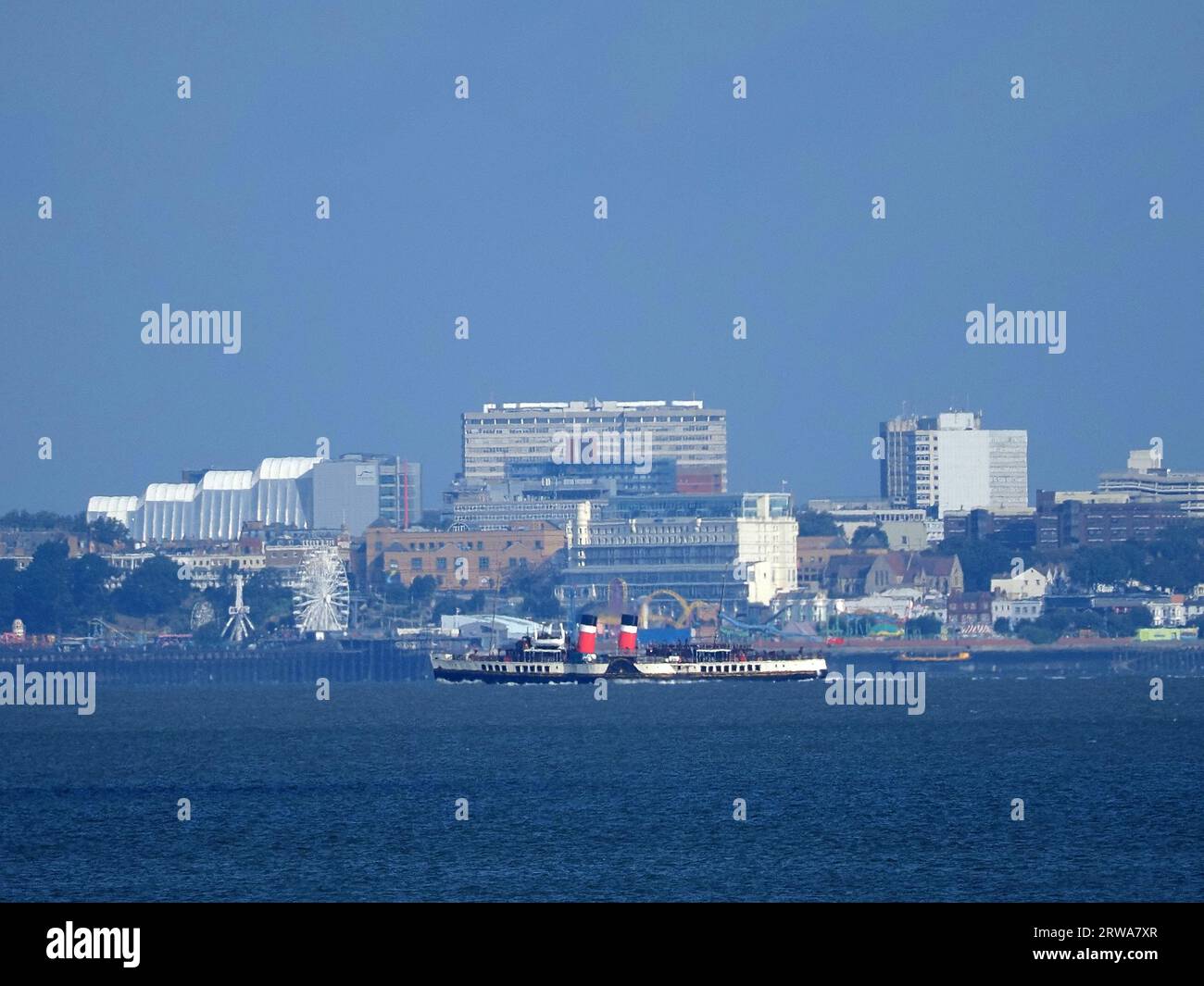 Sheerness, Kent, UK. 18th Sep, 2023. Historic Waverley paddle steamer arriving on the Thames this morning (as seen from Sheerness, Kent). Due to predicted strong winds she's berthing at Gravesend for safety all week until her first official Thames estuary trip on Friday. Pic: passing Southend on Sea pier in the background. James Bell/Alamy Live News Stock Photo